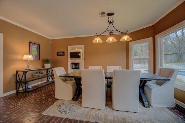 dining area with crown molding