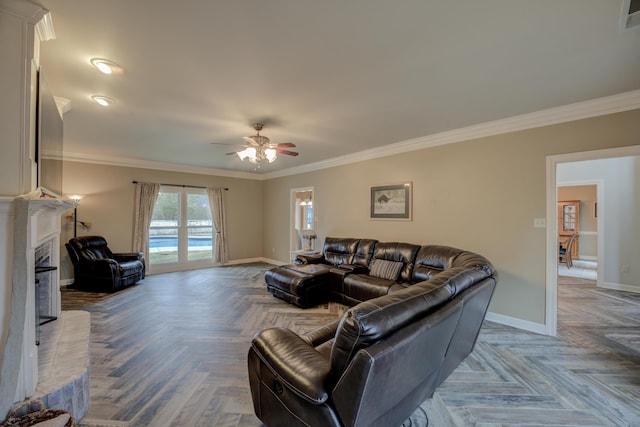 living room with ceiling fan, parquet flooring, and crown molding