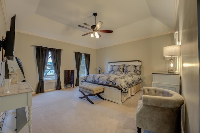 carpeted bedroom featuring a raised ceiling, ceiling fan, and crown molding