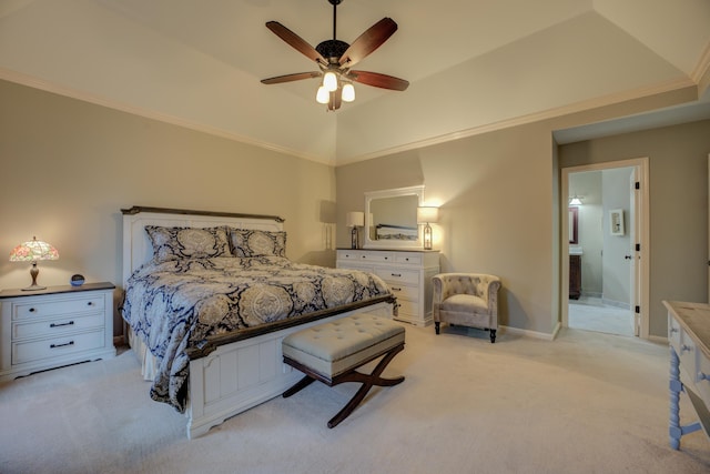 carpeted bedroom with ensuite bathroom, a raised ceiling, ceiling fan, crown molding, and lofted ceiling