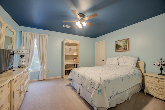 bedroom featuring ceiling fan and light carpet