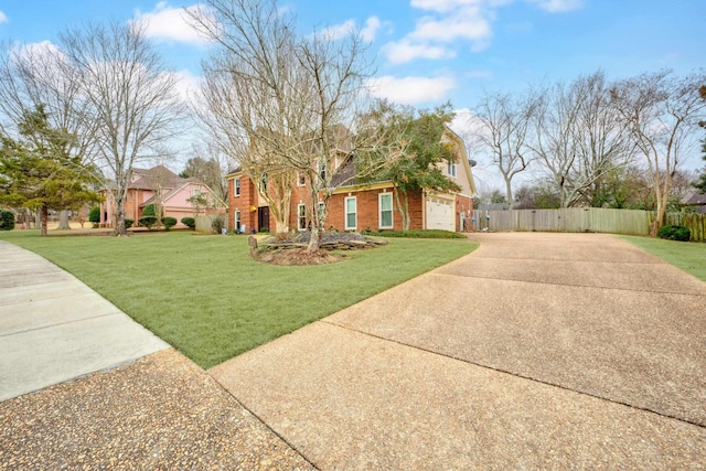 view of front facade featuring a front yard and a garage