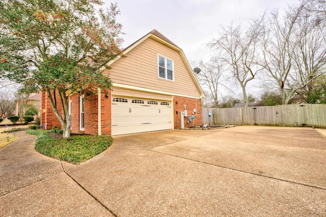 view of side of home featuring a garage