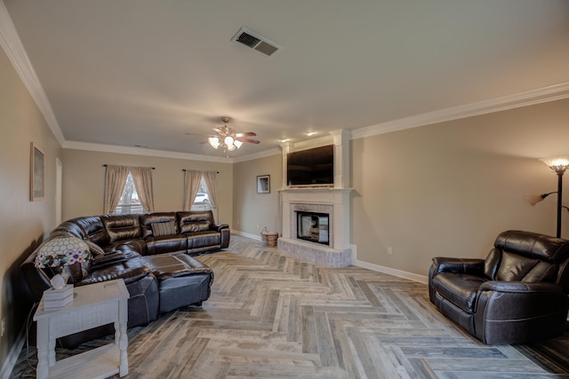 living room with ceiling fan, crown molding, and light parquet flooring