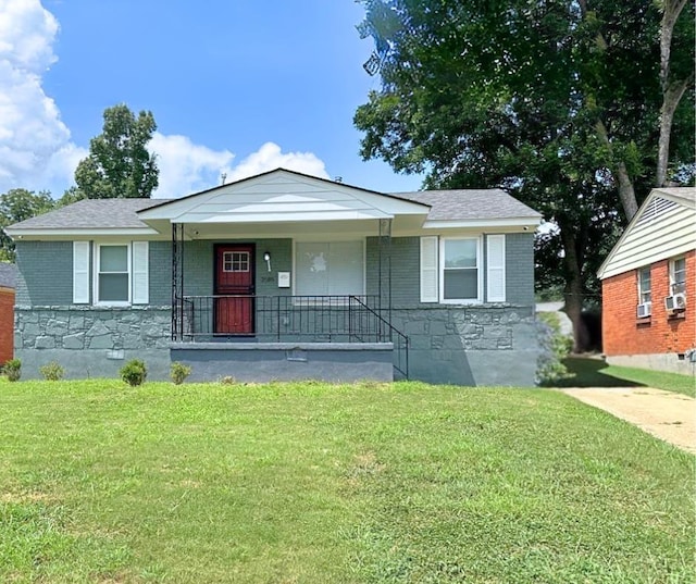 bungalow featuring a front yard, cooling unit, and covered porch