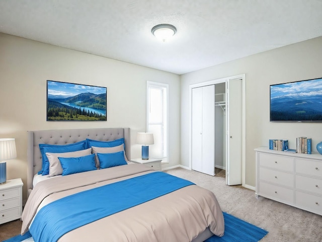bedroom with light colored carpet and a closet