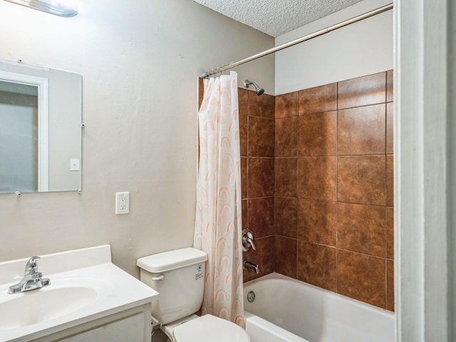 full bathroom with shower / bath combo, toilet, a textured ceiling, and vanity