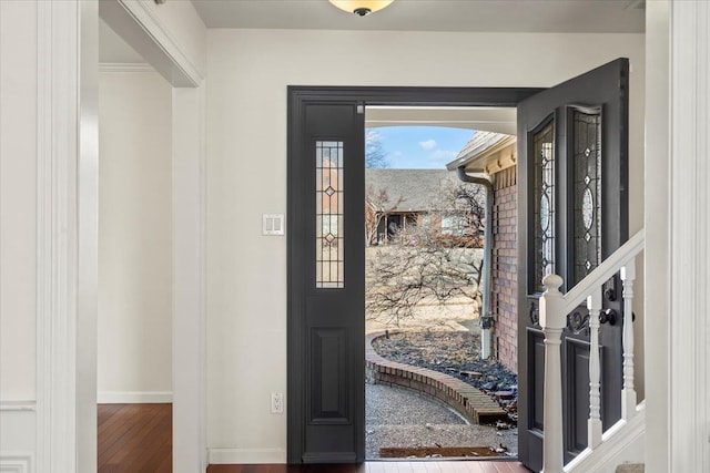 foyer entrance with hardwood / wood-style flooring