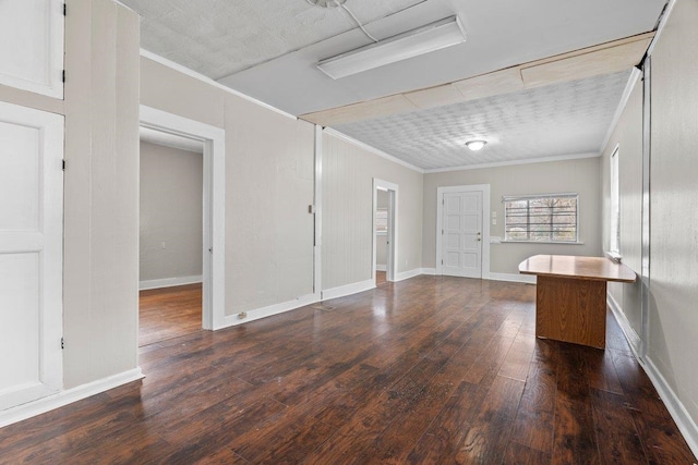 unfurnished room featuring dark hardwood / wood-style floors and ornamental molding