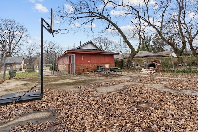 view of property exterior featuring a gazebo and cooling unit