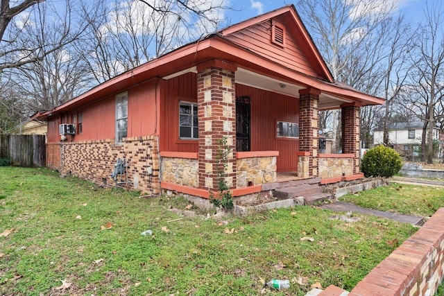 view of property exterior featuring a lawn and a porch