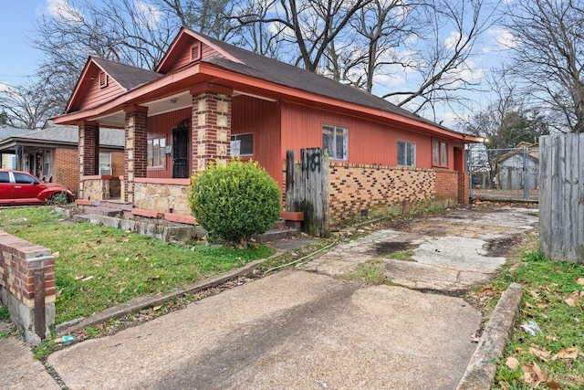 view of side of property featuring a porch