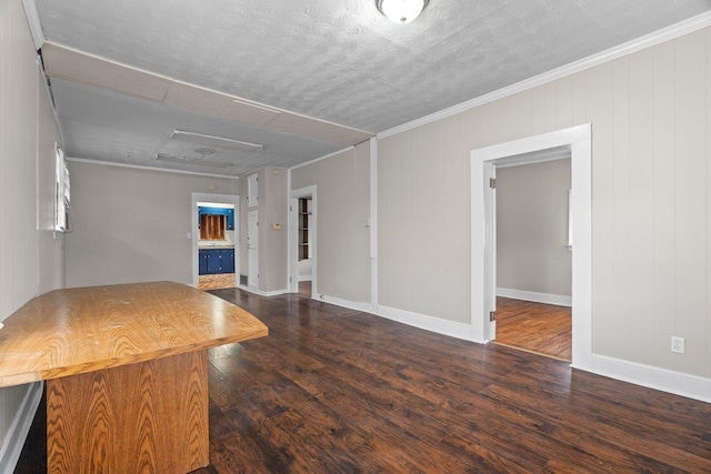 unfurnished living room with a textured ceiling, dark hardwood / wood-style floors, and crown molding