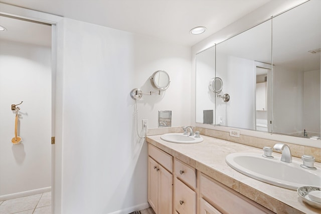 bathroom with tile patterned flooring and vanity