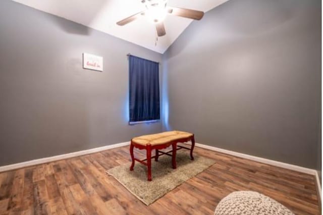 interior space with hardwood / wood-style flooring, ceiling fan, and lofted ceiling