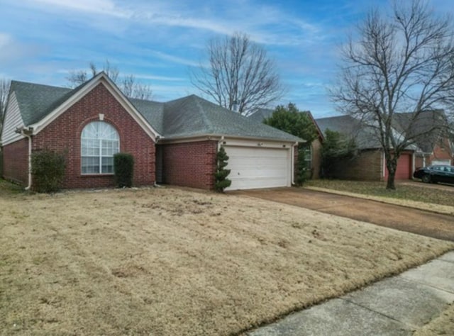 ranch-style home with a garage