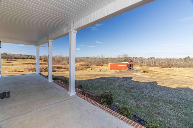 view of yard with a rural view