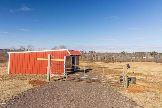 view of outbuilding featuring a rural view