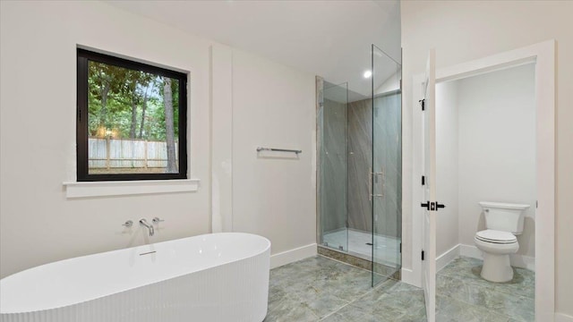 bathroom with separate shower and tub and toilet