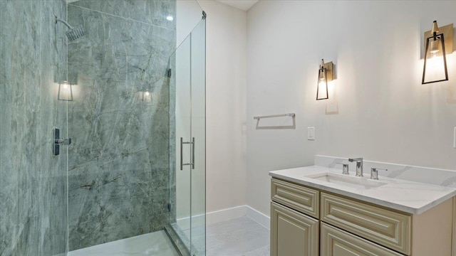 bathroom with vanity and a shower with door