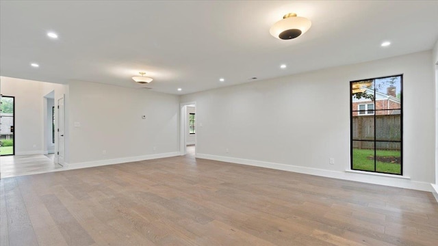 unfurnished room with light hardwood / wood-style floors