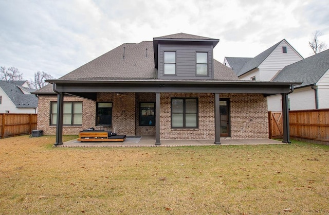 back of house with a yard, central AC, and a patio area