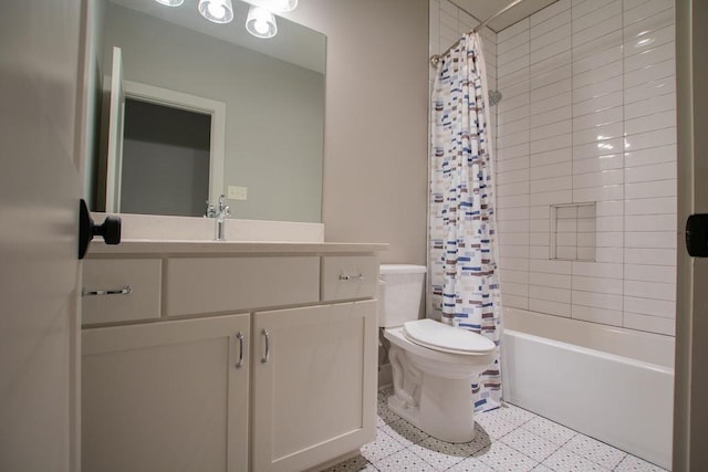 full bathroom featuring shower / bath combo, toilet, and vanity