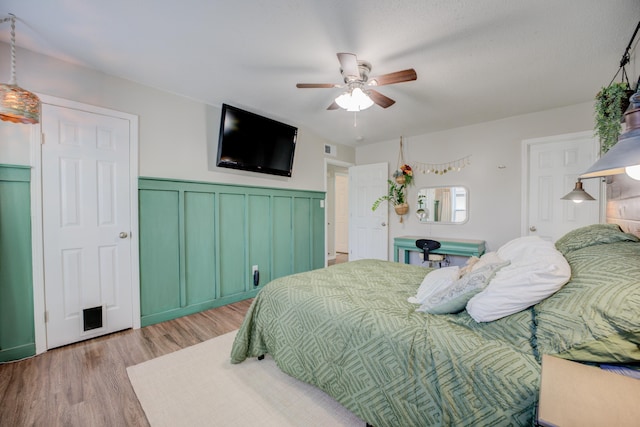 bedroom featuring ceiling fan and light hardwood / wood-style floors