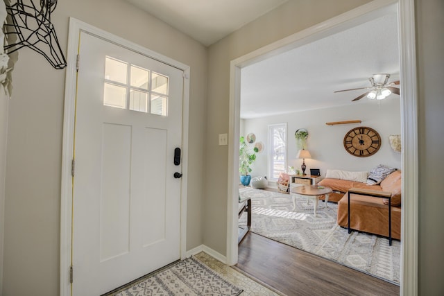 foyer featuring ceiling fan and hardwood / wood-style flooring