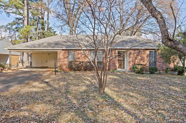 ranch-style home featuring a carport