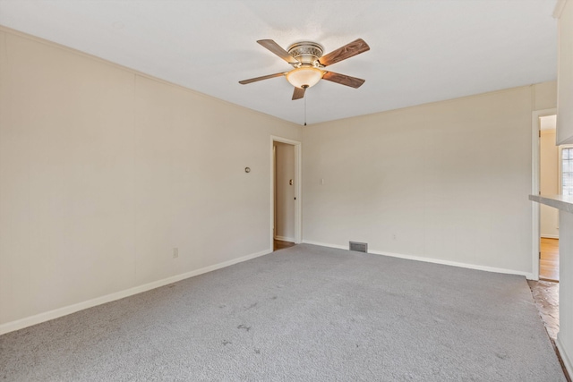 carpeted empty room with ceiling fan