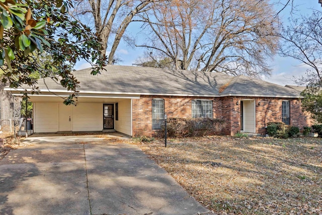 ranch-style home featuring a carport