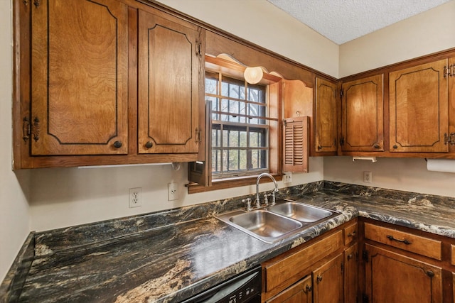 kitchen with black dishwasher, a textured ceiling, and sink