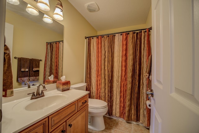 bathroom featuring tile patterned floors, vanity, and toilet