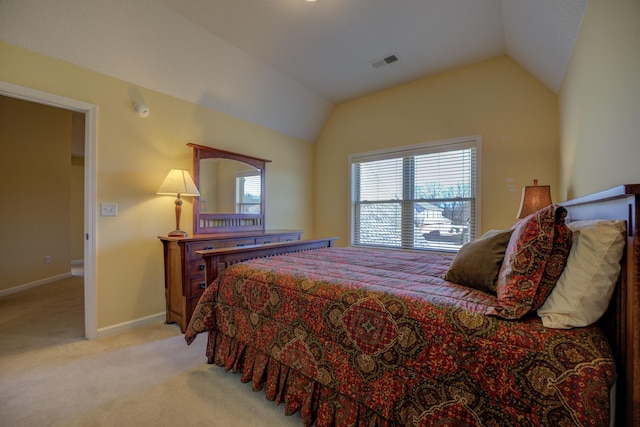 carpeted bedroom featuring vaulted ceiling