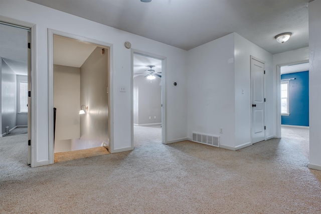 empty room with light colored carpet