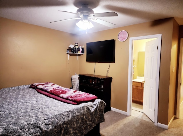 carpeted bedroom with ceiling fan and connected bathroom