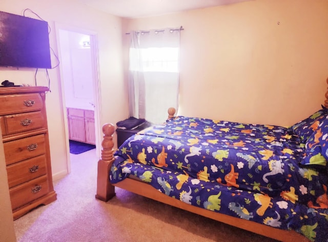 carpeted bedroom with ensuite bathroom