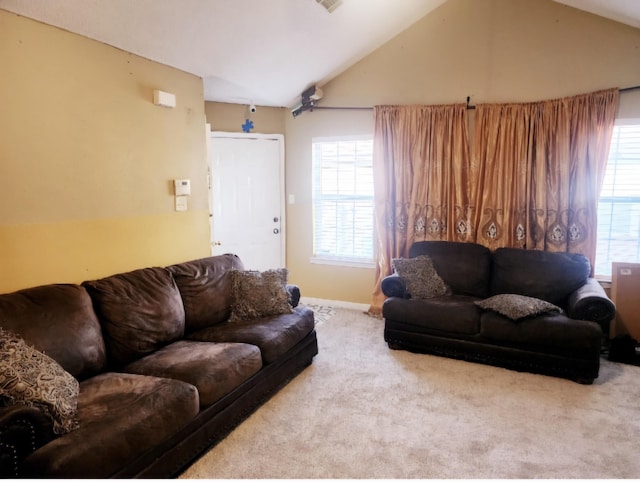 living room with carpet floors and lofted ceiling