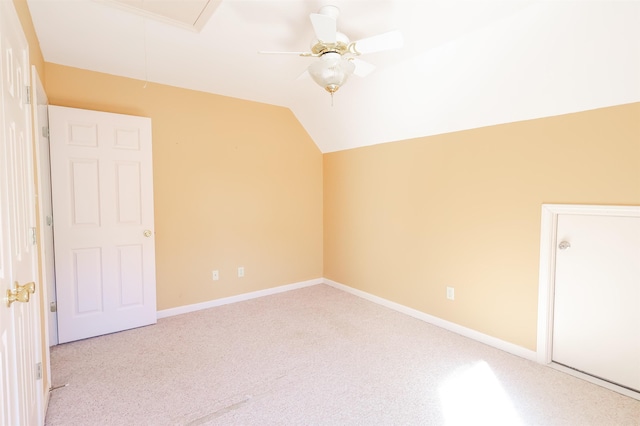 interior space with lofted ceiling and light colored carpet