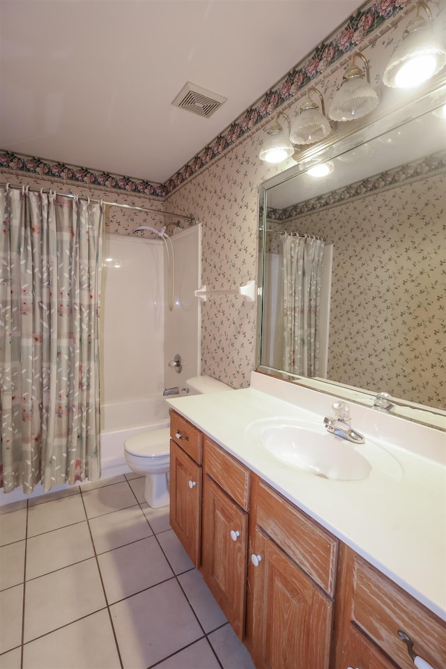 full bathroom with vanity, shower / bathtub combination with curtain, tile patterned floors, and toilet