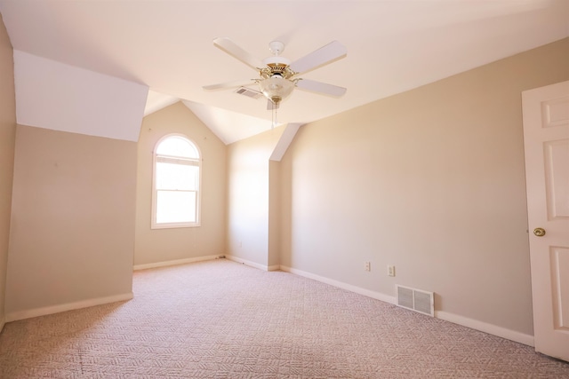 bonus room with ceiling fan, lofted ceiling, and light carpet