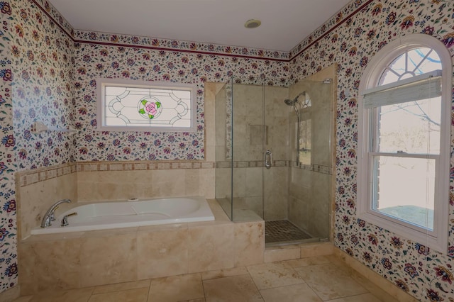 bathroom with tile patterned floors and separate shower and tub