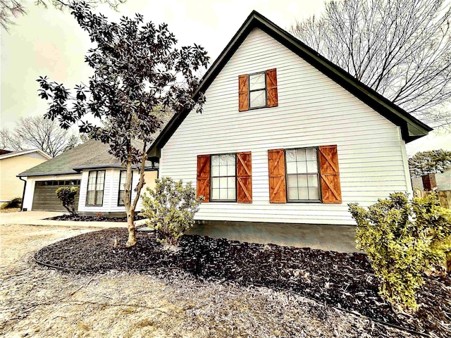 view of side of property with a garage