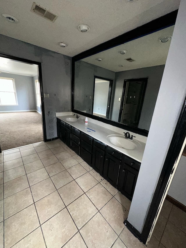 bathroom with tile patterned flooring and vanity