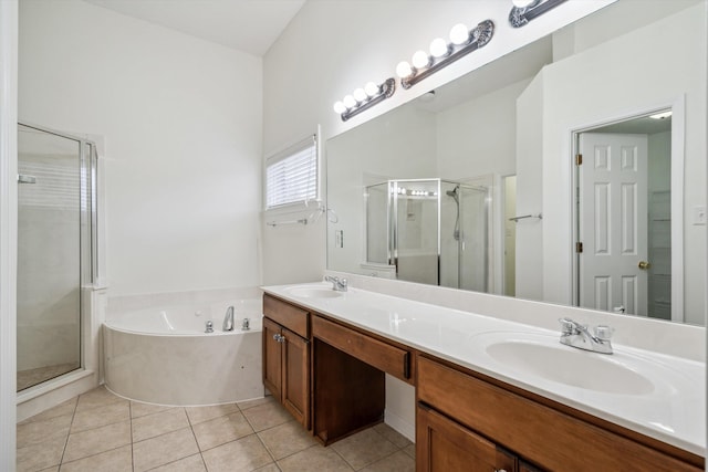 bathroom with tile patterned flooring, vanity, and separate shower and tub