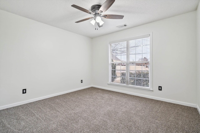 unfurnished room featuring ceiling fan and carpet floors