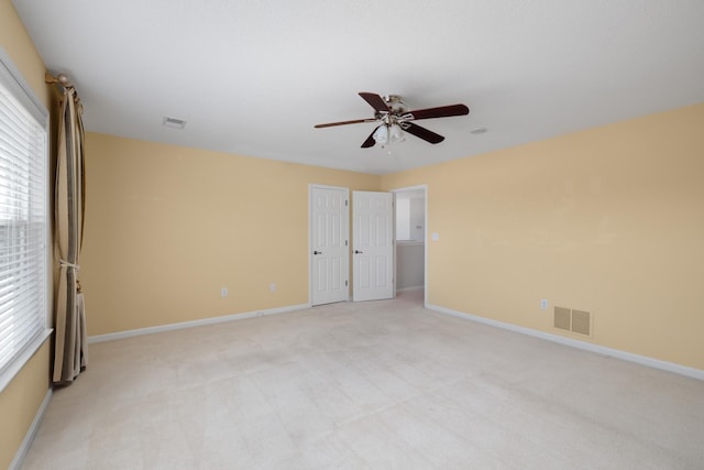 carpeted empty room with ceiling fan