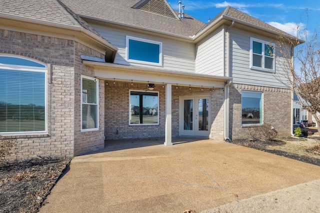 rear view of property with a patio and french doors