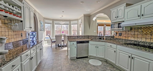 kitchen with white cabinets, crown molding, sink, and stainless steel appliances